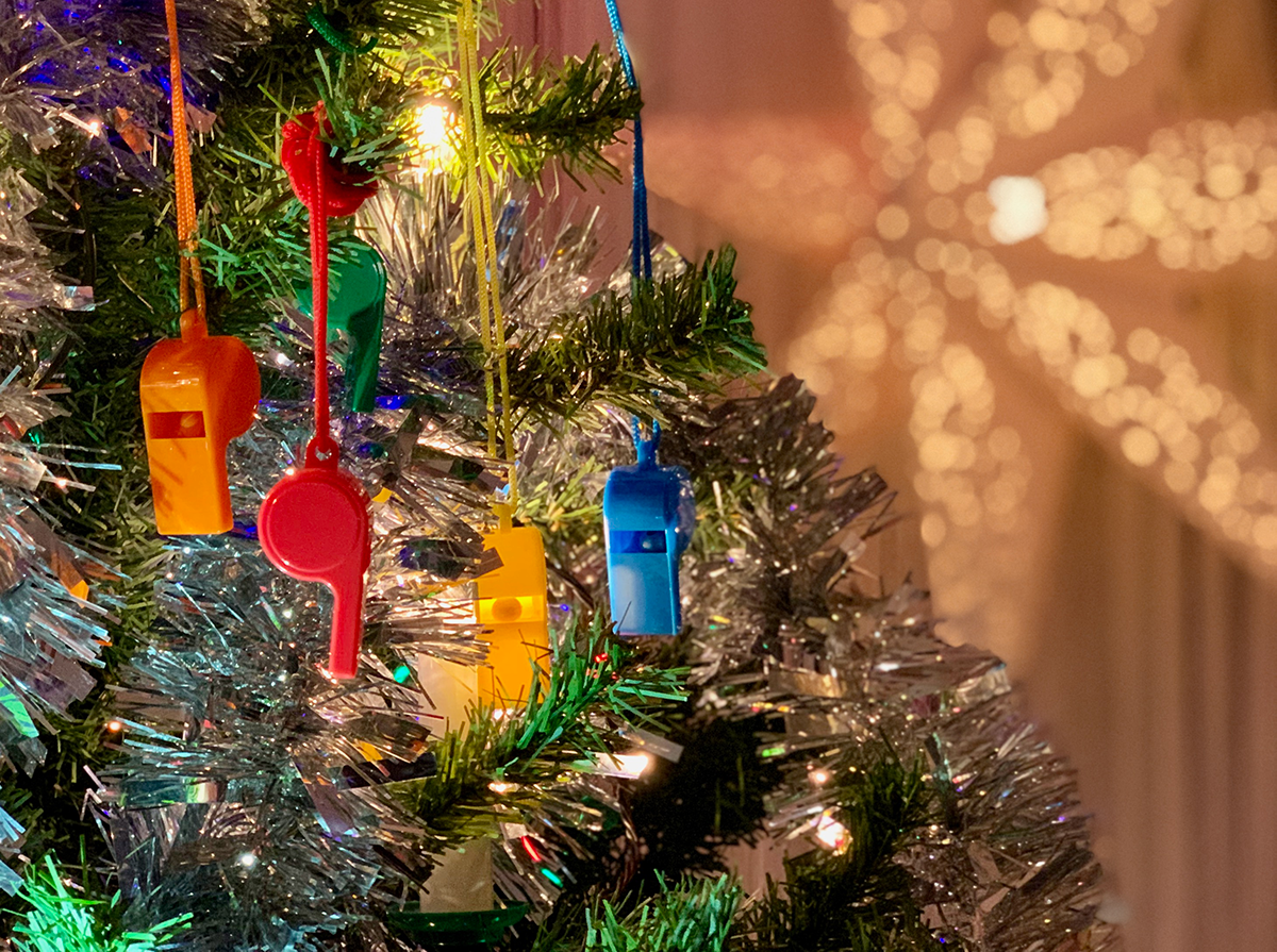 Colorful whistles in a Christmas tree